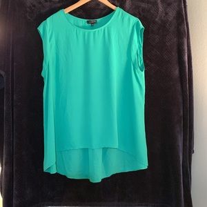 Very pretty green blouse. Sits lower in the back